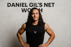 A headshot of a smiling Daniel Gil in a black tank top, with the text "Daniel Gil's Net Worth" overlaid on the image
