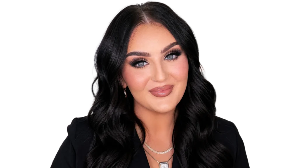 "Professional portrait of beauty influencer Mikayla Nogueira in a brightly lit makeup studio, featuring her signature glamorous makeup look and a confident smile, suitable for a blog post about her net worth and career."